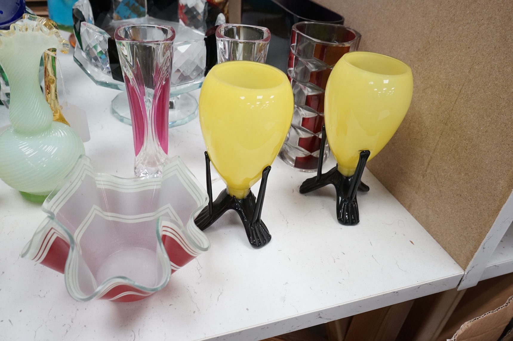 Mixed glassware to include a green Mary Gregory jug, a 'vaseline' glass ewer, an Art Deco style clear and black glass fruit tazza, etc.
